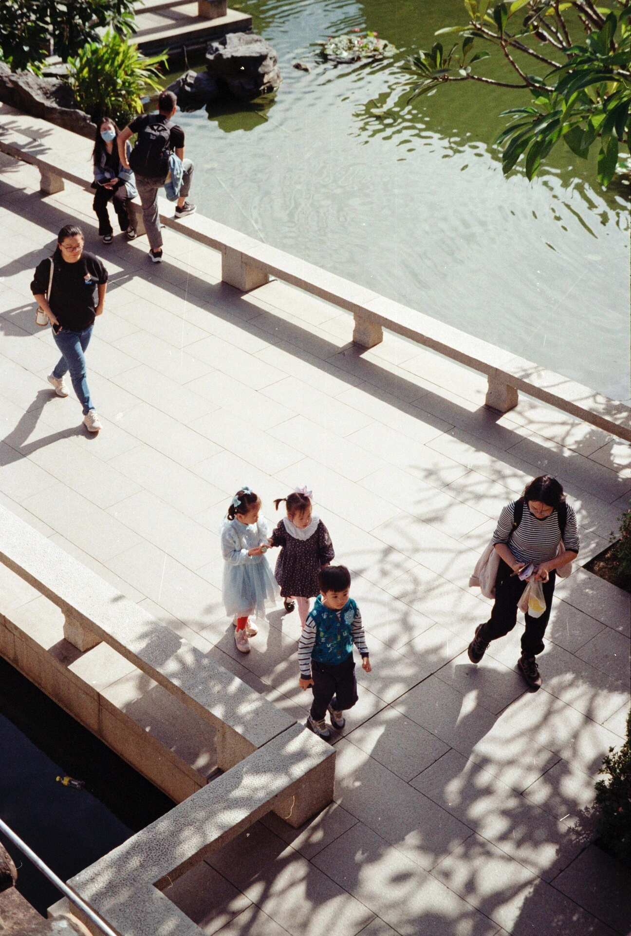 Children on a sunlit path — soft contrast